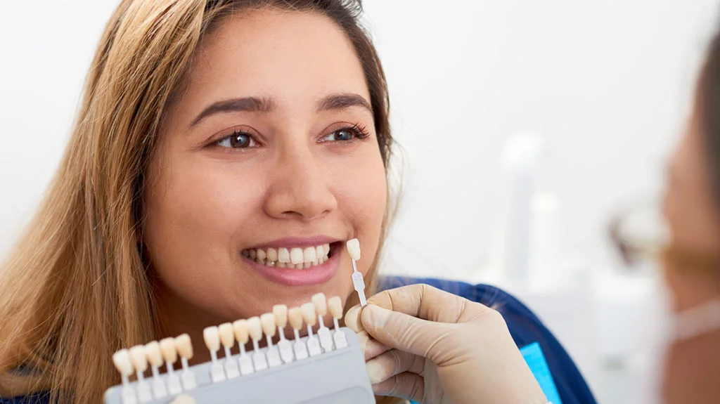 Girl deciding her teeth shade