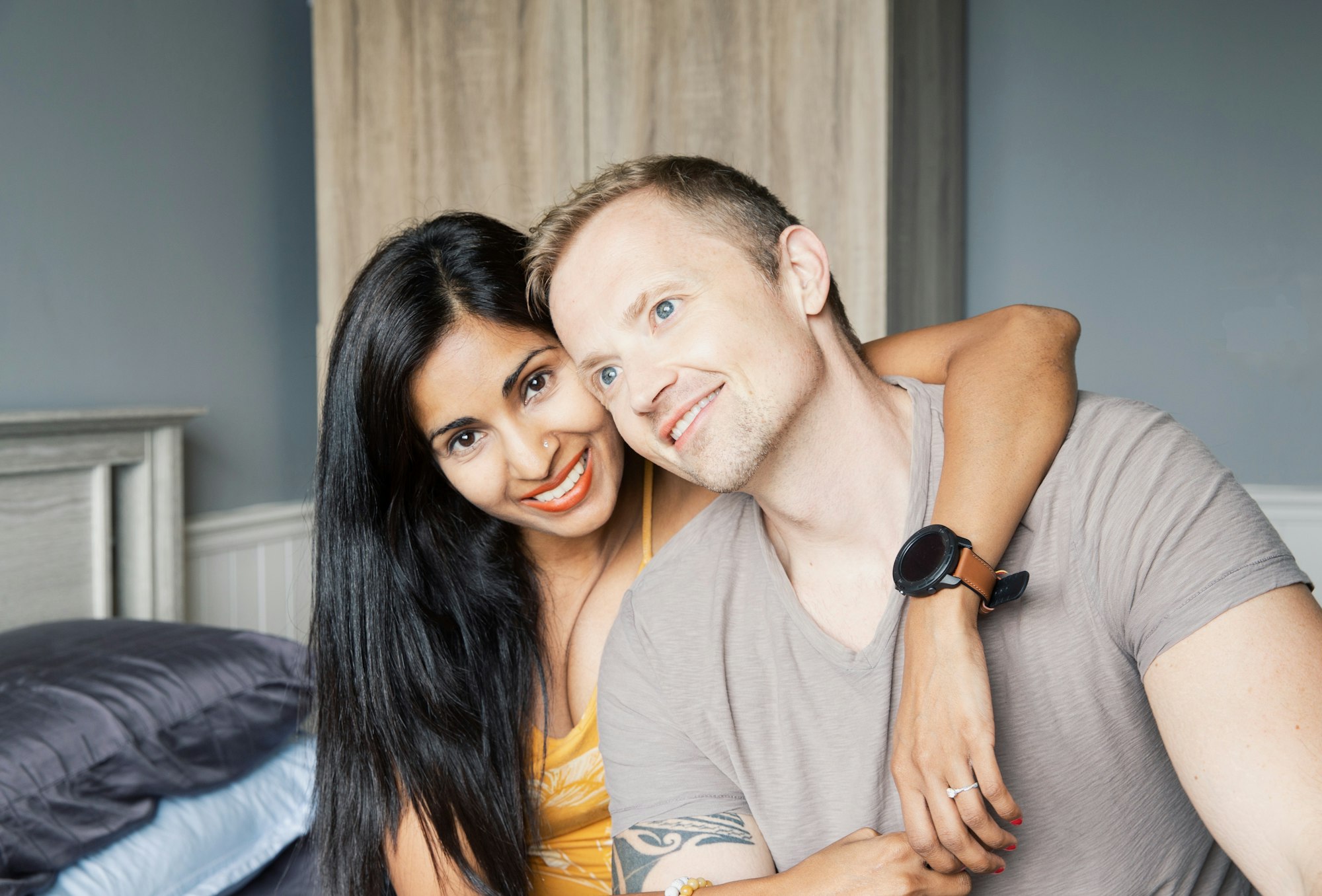 Interracial couple smiling, happy and in love