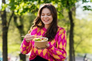 A woman eating a poke