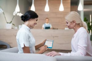 Woman fixing a meeting with her dentist